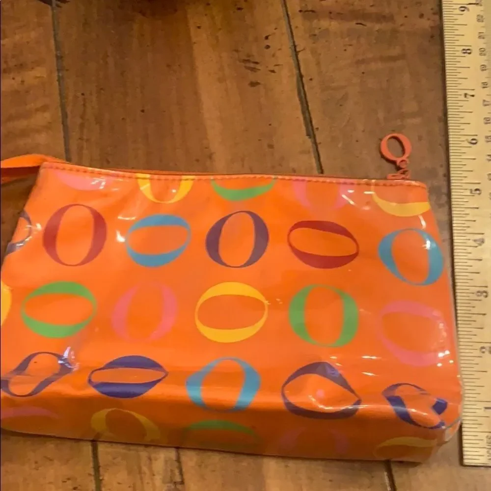 Never used Rare Oprah Orange O Logo Cosmetic bag.